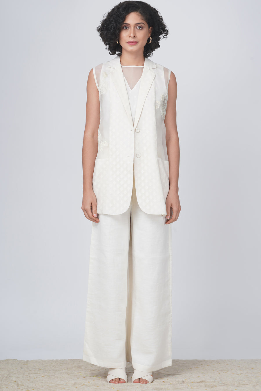 Sleeveless jacket with bara embroidery in banarsi chanderi and flared pant in linen